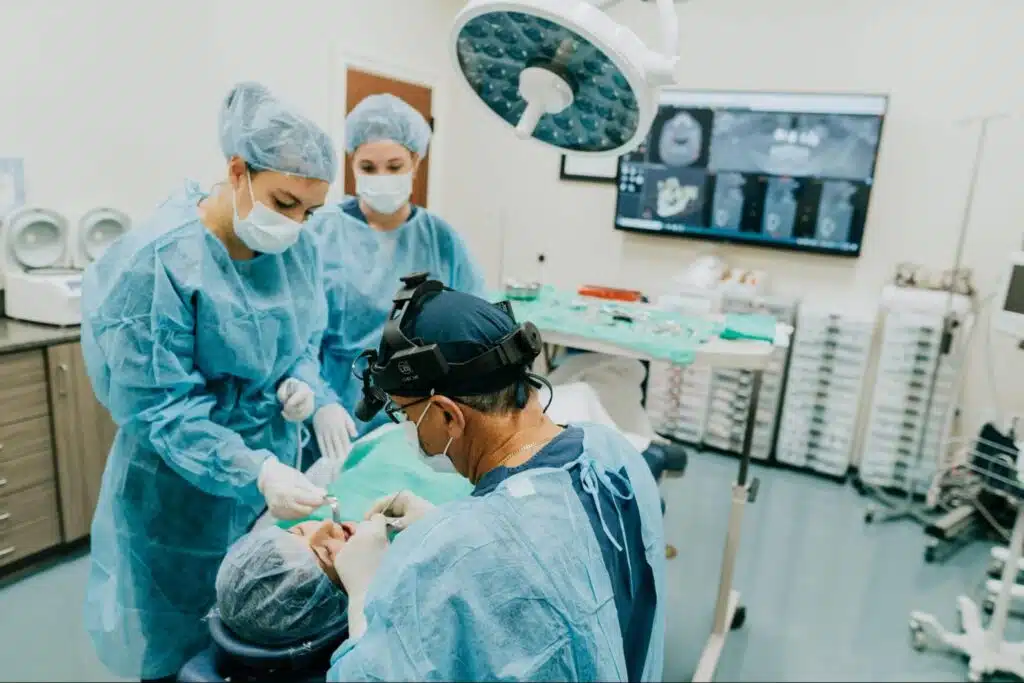 Oral surgeon performing jaw surgery to correct jaw alignment